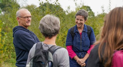 Minister Creagh speaking with people at a community woodland site 1